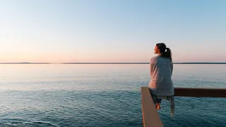 woman looking out at water