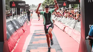 Carla Annas crossing the finish line at the Durban Ironman 70.3 race