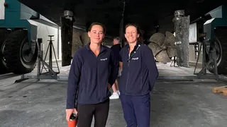 Couple working together on superyacht deck as yacht crew